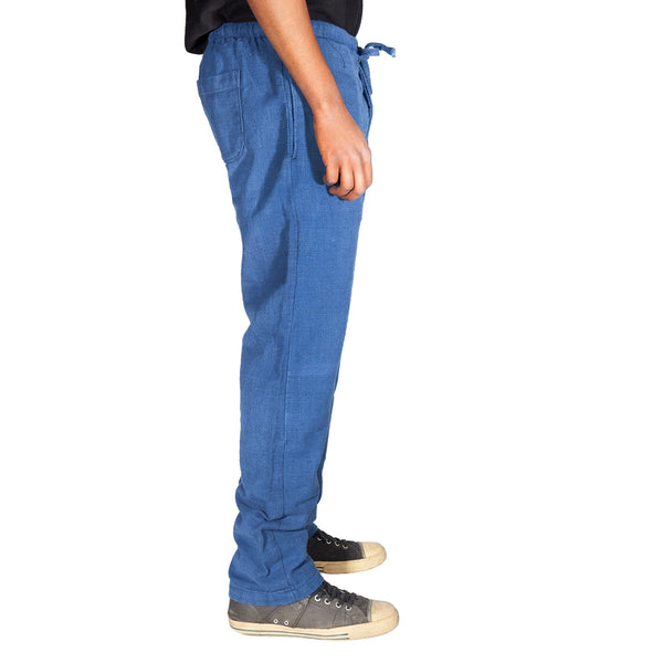 Person wearing blue pants on a white background