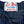 Close-up of a denim fabric with a 'Left Field Sportswear New York City' label.