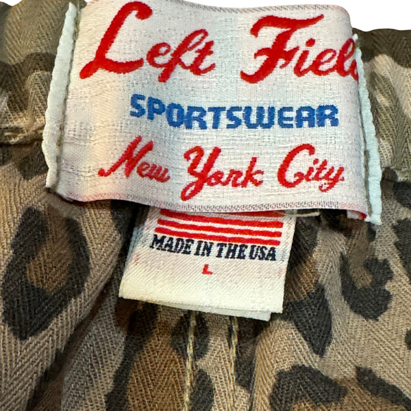 Sportswear label with 'Left Field Sportswear New York City' text on a patterned fabric background.