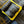 Gold metal buckle on a denim fabric background
