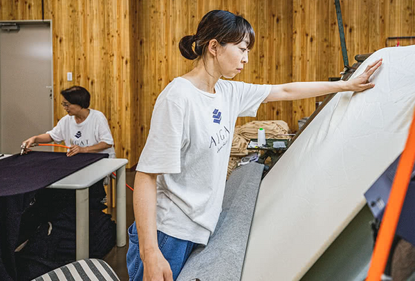 worker making tee fabric