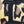 Close-up of a leopard-print fabric patch with a large black embroidered letter 'I'.